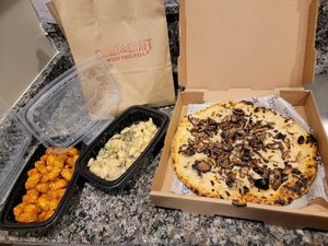 The funghi pizza with vegan bechamel and vegan cheese, vegan porchini pasta, side of tots at Crust & Craft in Rehoboth Beach