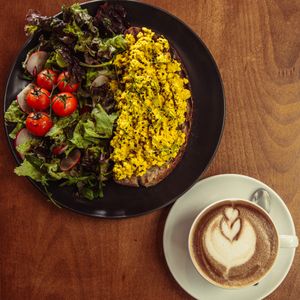 Tofu scramble and Cappuccino with homemade plant milk  at VeZa in Belgrade