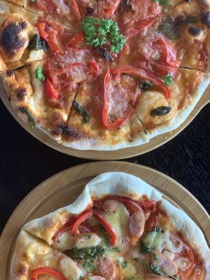 Vegan pizza top and non veg bottom  at Suggoi Sports Cafe in Kochi