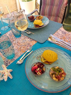 Vegan Burger with red lentil pan cakes, red beet salad and chickpea salad as starter. With fresh home grown sprouts. at Vegantisch  in Alicante