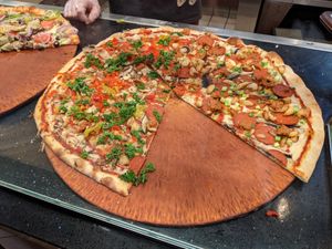 Vegan Sur and Mt Diablo vegan pizza options by the slice at Pizza My Heart in Monterey