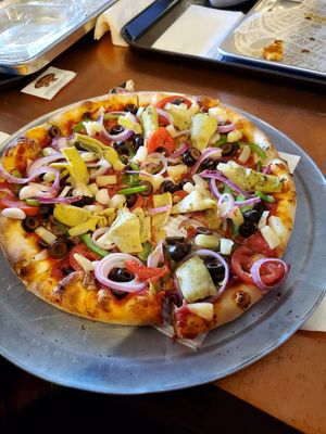Pizza with a bunch of veggies at Pizza My Heart in Monterey