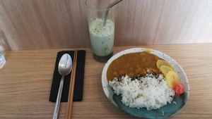 Rice and curry, matcha latte. at Mori Cafe in Paris