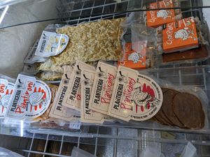 Deli case packaged meats at Planticeria in Panama City