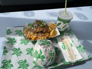 Burger, cluckin fries and a drink (over £20) at Oowee Vegan in North London