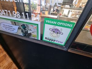 Happy Cow sticker at Eviedemment in Ronse