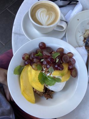 Greek yoghurt with yummy toppings and cappuccino   at À la Lo in Stockholm