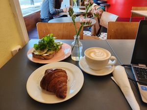 Croissant and avotoast with a beautiful latte at À la Lo in Stockholm