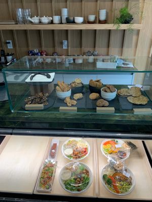 View from inside the shop with bowls, salads and baked goods at WholeLifeGo in Calgary