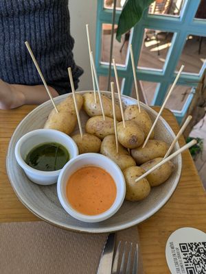 Papas con mojo verde y rojo at Agüita in Salinas