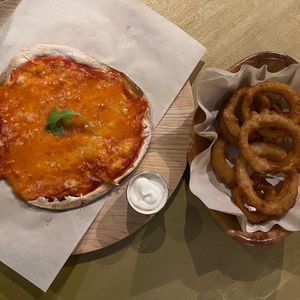 Cheesy garlic pizza bread and onion rings at Timmy's Bar & Kitchen in Carlisle