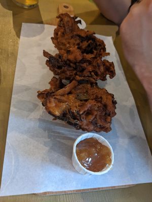 Vegan onion bajis with chutney and mint raita. at Timmy's Bar & Kitchen in Carlisle