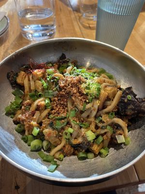 Spicy Szechuan noodles ft. udon noods, baby corn, wood ear mushrooms, green onions, + saffron  at ima - Midtown in Detroit