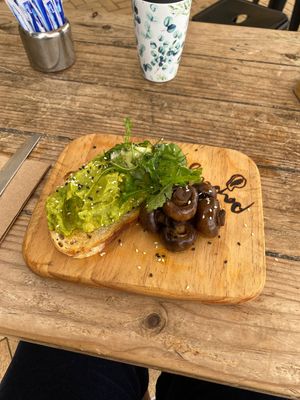 Smashed avo with mushrooms and mocha with vegan choc powder  at Papaya in Lennox Head