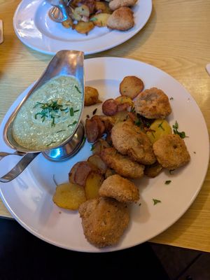 Vegan schnitzel with potatoes and green sauce at Zum Eichkatzerl in Frankfurt