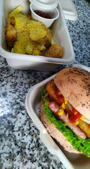Cheesy Taters & Nuggets. Bacon & Hash. 💚🤤 All in compostable takeaway boxes! at Kindred Cafe in Davao City