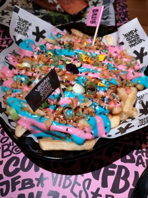 Iconic rainbow fries at Vegan Junk Food Bar - El Born in Barcelona