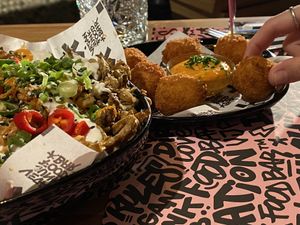Mac and cheeze balls with loaded fries at Vegan Junk Food Bar - El Born in Barcelona