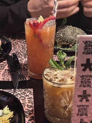 Dragonfruit/pitaya cocktail and a vegan Irish cream cocktail at Vegan Junk Food Bar - El Born in Barcelona