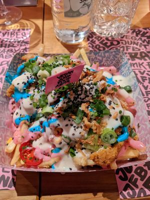 Iconic rainbow fries at Vegan Junk Food Bar - El Born in Barcelona