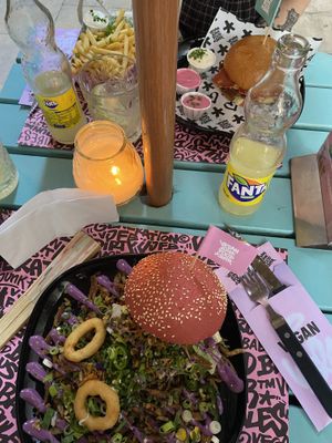 the beastie burger with onion rings  at Vegan Junk Food Bar - El Born in Barcelona