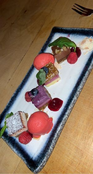 Amazing dessert, the flavors were: coconut with chocolate, raspberry with passion fruit, blueberry with date, hazelnut chocolate. And some raspberry sorbet icecream 😍 at De Buurman in Heerenveen