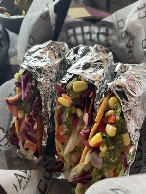 Firecracker shell, Rice, Beans, Thai chili tofu, lettuce, tomato, pickled cabbage, corn salsa, and Mexican chimichurri   at Condado Tacos - Polaris  in Columbus