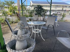Cute outdoor seating area (covered)  at Tabaraka in Hilo