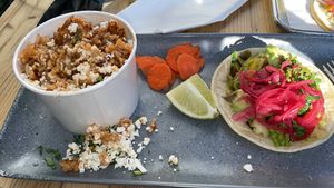 Veggie taco - pickled onions a nice touch, along with pickled carrots and slice of lime.   forgot to ask for no cheese on rice and beans. at Taco Daddy's in Martinez