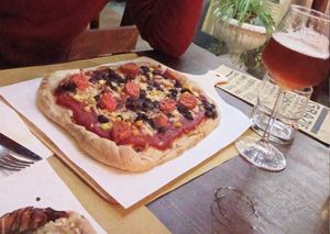 Mexican pizza (corn, mozzarella, black beans, wurst) at Laboratorio - Food. Drink. Green Cosmetics in Jesi