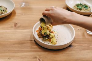 Roasted cauliflower with turmeric tahini sauce, house-pickled chilli, onion and ginger, dried
kalamata olives, pistachio crumble at Mother in Fremantle