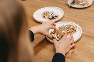 Soft stoneground corn tacos topped with spiced hibiscus ‘mince’, chipotle sauce, cabbage,
fresh herbs, pickled onion, housemade ‘yoghurt’, charred paprika  at Mother in Fremantle