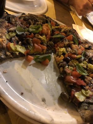 Pizza with special roasted dough  at Oasi La Pizza in Imperia