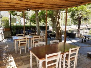 Outdoor seating at Osteria all'Orrido in Ponte Brolla