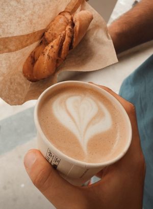 Cappucino and cinnamon pastry at WAY Specialty Coffee Roasters in Ghent