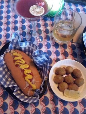 Deep fried olives filled w/cashew cheese, vegan hot dog at Woof! in Dunedin