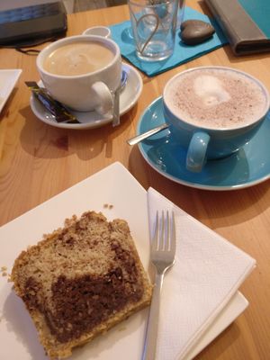 Nutcake, hot chocolate and cafe crema with oatmilk (Oatly Barista) at Kaffeetasse in Buehl