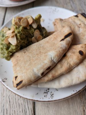 Roast garlic, Dill, Almond & Preserved Lemon Hummus, with hot pita bread at The Punter in Oxford