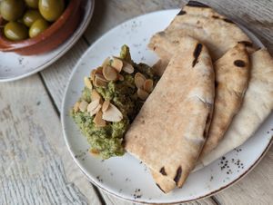 Roast garlic, Dill, Almond & Preserved Lemon Hummus, with hot pita bread at The Punter in Oxford