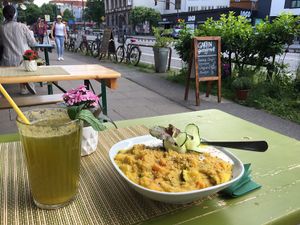 curry dish and orange sparkling lemonade at Golden Temple Teehaus in Hamburg