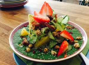 Green SmoothieBowl with fresh  pineapple, awesome. at Golden Temple Teehaus in Hamburg
