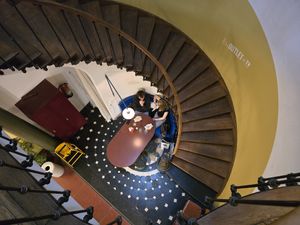 Spiraling stairs (toilets upstairs) at Steamy Windows in Ghent
