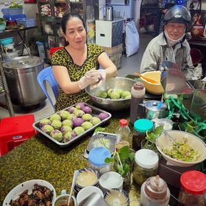 Staff preparing the sticky rice packages at Co Ba in Long Xuyen