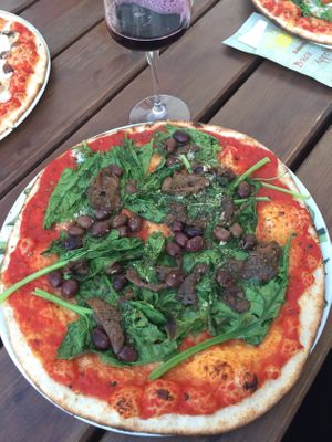 build your own pizza: spinach, olives, porcini, and garlic at Pizzeria Il Faro in Borkum