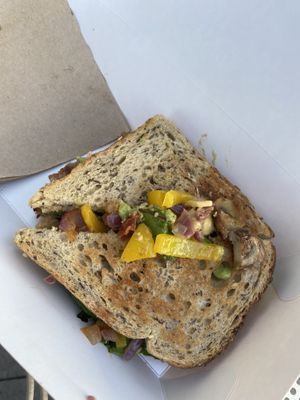 Vegan toastie - beyond meat, onion, mushrooms, sundried tomatoes, vegan cheese, pepper  at Healthylicious UK in Brighton