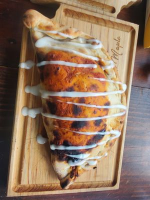 Vegan Mexican pizza calzone at Sol de Maple in Cozumel