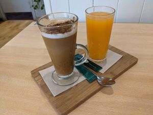 Cappuccino with almond milk and fresh orange juice at Yemaya in Vigo