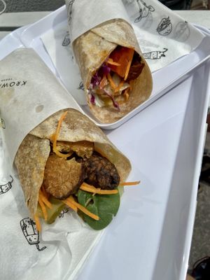 Tempeh in full grain wrap (left) and “pastrami” in full grain wrap (right). at Krowarzywa - Monte Cassino in Szczecin