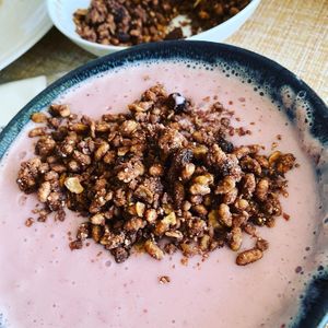 Smoothie bowl with granola strawberries bananas  at The Creek Bistro Chic in Tunis