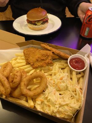 Burger and pizza box with fries, chicken, coleslaw and onion rings   at Zero Clucks Given in Birkenhead